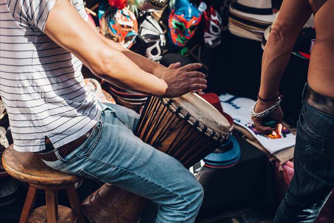 man playing bongo drum