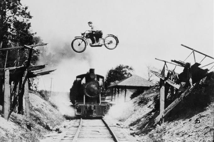 motorbike flying over train