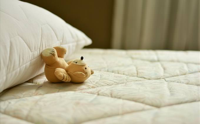 mattress and teddy bear close-up
