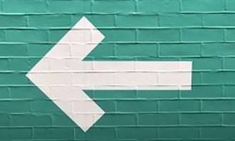 White arrow on a green background