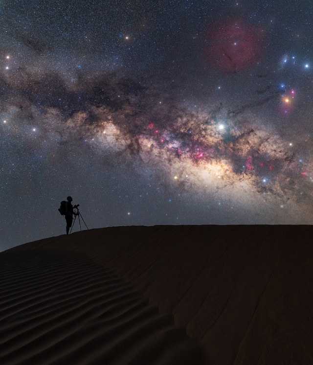 Best and colorful photographs of the Milky Way taken from different locations around the world, provided by Capture the Atlas editor Dan Zafra, “Alone & Together in the Stardust” by Marco Carotenuto, taken in the Sahara desert