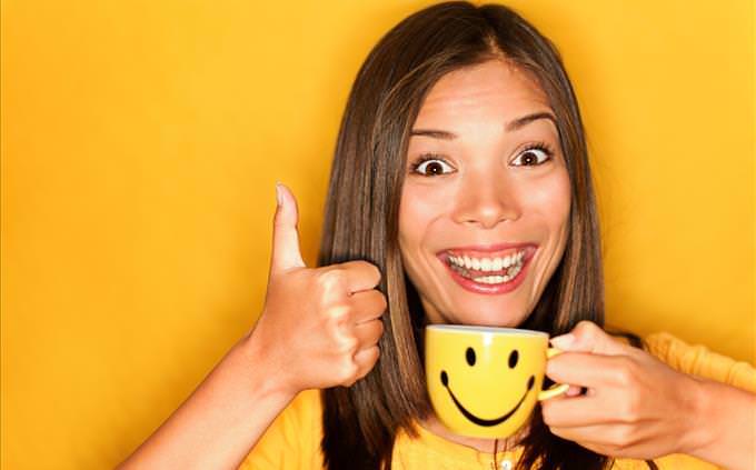 happy woman on yellow background