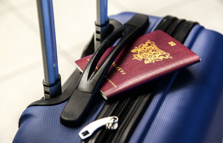 Passport Colors passport on suitcase