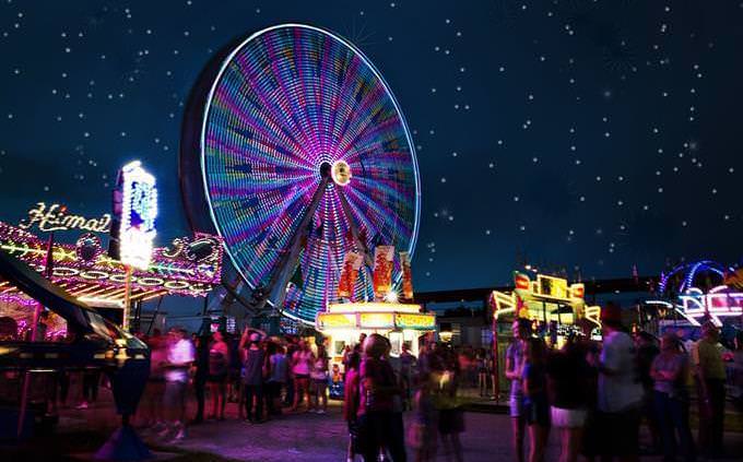 An amusement park’s Ferris wheel at night
