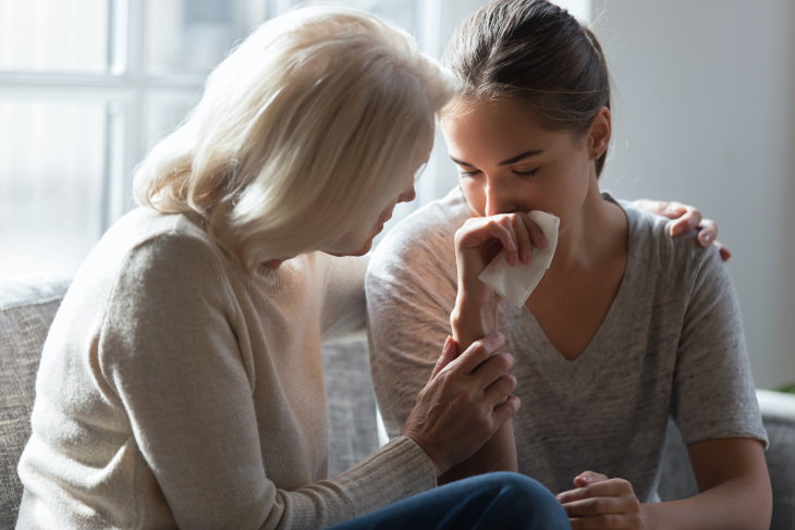 How to Help Someone Having a Panic Attack woman comforting girl
