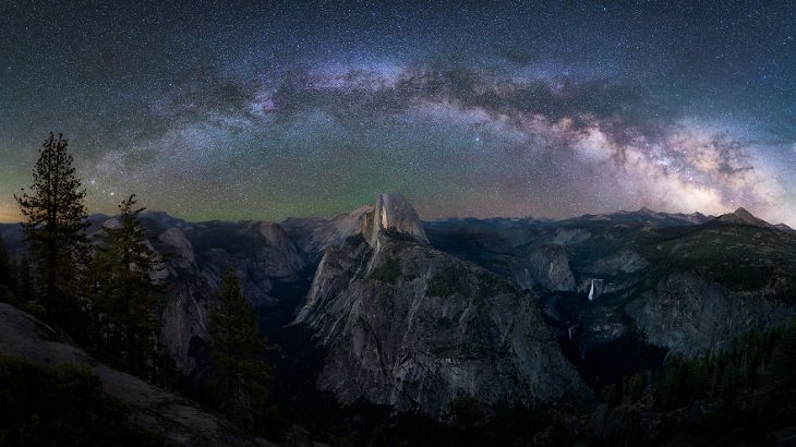 Astronomy photographs of the night sky and nightscapes by Marcin Zajac, Top of the World, The Milky Way creates an arch of space and beauty over Yosemite Valley, covering the Half-Dome, as seen from Glacier Point in western Sierra Nevada