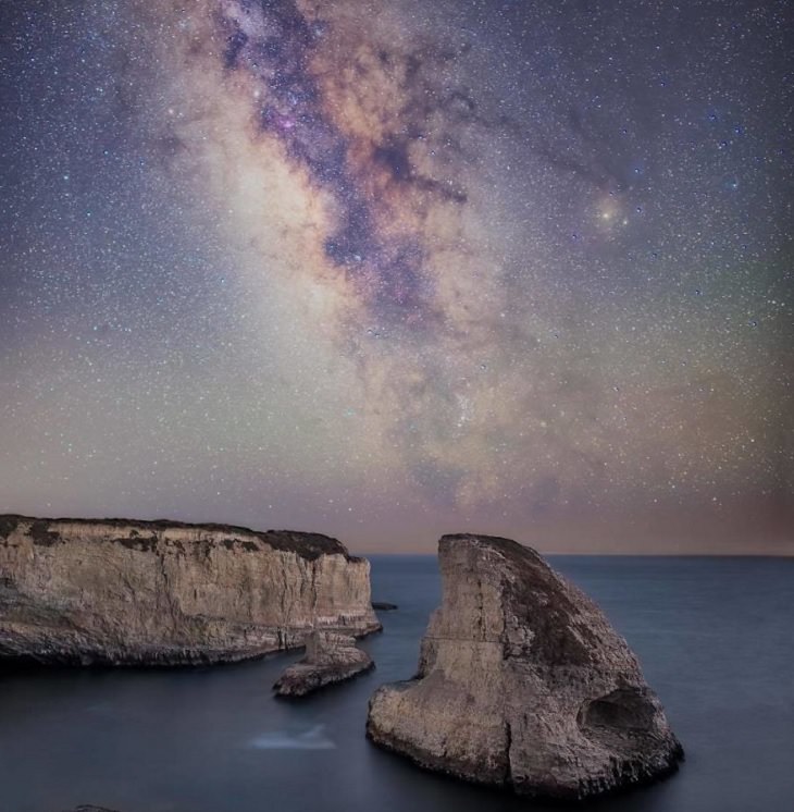 Astronomy photographs of the night sky and nightscapes by Marcin Zajac, Shark Fin Cove Beach, on the coast of Santa Cruz lies Shark Fin Rock in Shark Fin Cove Beach over which the Milky Way rises